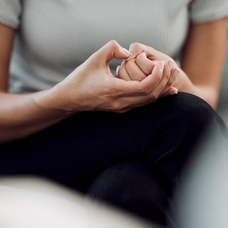 A common sign of anxiety is subconscious skin picking. Cropped shot of an unrecognisable woman sitting alone and feeling anxious while picking the skin on her nails